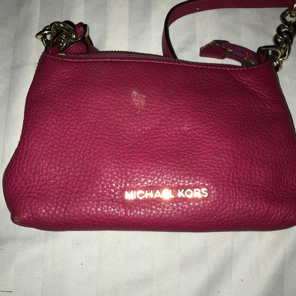 Burgundy Michael Kors pull over purse